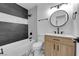 Well-lit bathroom featuring a tub, modern fixtures, stylish tile flooring, and a beautiful vanity at 2058 Citroen St, Las Vegas, NV 89142