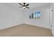 A neutral bedroom featuring a ceiling fan and a window with shutters at 2058 Citroen St, Las Vegas, NV 89142