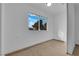 Bedroom with neutral carpet, window views, and white walls at 2058 Citroen St, Las Vegas, NV 89142