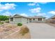 Charming single-story home with desert landscaping, a brick accent, and a paved driveway at 2058 Citroen St, Las Vegas, NV 89142