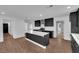 Bright, modern kitchen with an island, stainless steel appliances, and sleek black cabinetry at 2058 Citroen St, Las Vegas, NV 89142