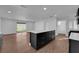 Kitchen island in an open-concept space with hardwood floors and modern appliances at 2058 Citroen St, Las Vegas, NV 89142