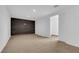 Open-concept living room with neutral carpet, and accent wall, and a large open closet at 2058 Citroen St, Las Vegas, NV 89142