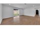 Bright living room featuring a sliding glass door and wood-look floors at 2058 Citroen St, Las Vegas, NV 89142