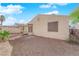 A view of backyard with desert landscaping featuring a covered porch and privacy walls at 2136 Velvet Hill Ave, Las Vegas, NV 89106