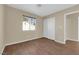 Bedroom with wood-look floors, window, and a closet for storage at 2136 Velvet Hill Ave, Las Vegas, NV 89106