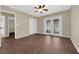 Bright bedroom with wood-look flooring, ceiling fan, and glass patio doors at 2136 Velvet Hill Ave, Las Vegas, NV 89106