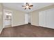 Spacious bedroom with wood-look flooring, a ceiling fan, and ensuite bathroom at 2136 Velvet Hill Ave, Las Vegas, NV 89106