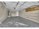 An interior view of garage featuring shelves, cabinets, and a new water heater at 2136 Velvet Hill Ave, Las Vegas, NV 89106