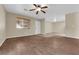 Bright and open living space with wood-look floors, natural light, and a welcoming front door at 2136 Velvet Hill Ave, Las Vegas, NV 89106