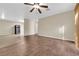 Spacious living room featuring modern ceiling fan, neutral walls, and wood-look floors at 2136 Velvet Hill Ave, Las Vegas, NV 89106