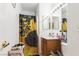 Bright bathroom with a shower and decorative sunflower curtain, with a modern vanity at 2510 Influential Ct, North Las Vegas, NV 89031