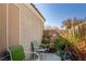 Relaxing patio features chairs, lush plants, and a charming butterfly detail at 2510 Influential Ct, North Las Vegas, NV 89031