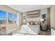 Cozy bedroom with neutral tones, three large windows offering natural light and views at 258 Paraggi Bay Dr, Henderson, NV 89011