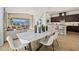 Spacious dining room with a marble-topped table, modern chairs, and an open view to the living area at 258 Paraggi Bay Dr, Henderson, NV 89011