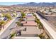 Scenic aerial view of homes within a neighborhood with mountain views at 2633 Flare Star Dr, Henderson, NV 89044