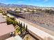 Scenic aerial view of the community showcasing the meticulously maintained flood control canal and desert landscape at 2633 Flare Star Dr, Henderson, NV 89044