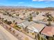 Expansive aerial view of a desert community with lush landscaping and sidewalks at 2633 Flare Star Dr, Henderson, NV 89044