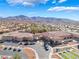 Aerial view showcasing community recreation center amenities with stunning mountain views in the background at 2633 Flare Star Dr, Henderson, NV 89044