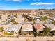 Scenic aerial view of a desert community with well-manicured lawns at 2633 Flare Star Dr, Henderson, NV 89044