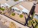 An aerial shot of a backyard featuring a covered patio and desert-style landscaping at 2633 Flare Star Dr, Henderson, NV 89044