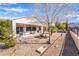 Backyard featuring desert landscaping, a covered patio, and mountain views at 2633 Flare Star Dr, Henderson, NV 89044