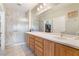 Modern bathroom with double vanity, a glass shower, and tiled walls at 2633 Flare Star Dr, Henderson, NV 89044