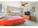 Sunlit bedroom with a large window and light colored walls at 2633 Flare Star Dr, Henderson, NV 89044