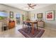 Dining area featuring stylish seating, area rug, and view to the outdoor patio at 2633 Flare Star Dr, Henderson, NV 89044