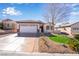 Inviting single-story house boasting a manicured front yard and a convenient two-car garage at 2633 Flare Star Dr, Henderson, NV 89044