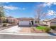 Attractive single-story residence showcasing a two-car garage, neat desert landscaping, and an inviting front lawn at 2633 Flare Star Dr, Henderson, NV 89044