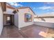 A cozy front entrance showcasing desert landscaping, a window with shutters, and front door at 2633 Flare Star Dr, Henderson, NV 89044