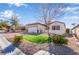 Charming single-story home with well-maintained landscaping, a neat lawn, and a two-car garage at 2633 Flare Star Dr, Henderson, NV 89044