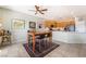 Bright kitchen with a breakfast bar, ample cabinet space, and a modern black refrigerator at 2633 Flare Star Dr, Henderson, NV 89044