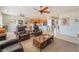 Open-concept living room with tile flooring and seamless flow to the adjacent kitchen at 2633 Flare Star Dr, Henderson, NV 89044