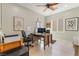 Home office with a ceiling fan, window, a work desk and tile floors at 2633 Flare Star Dr, Henderson, NV 89044