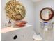 Modern bathroom with a face-shaped wall sculpture, vessel sink, and unique design at 2700 Las Vegas Blvd # 4002, Las Vegas, NV 89109