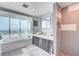 Contemporary bathroom features tub with city views and a walk-in shower at 2700 Las Vegas Blvd # 4002, Las Vegas, NV 89109