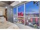 Bedroom with accent wall and floor-to-ceiling windows featuring nighttime city views at 2700 Las Vegas Blvd # 4002, Las Vegas, NV 89109