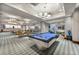 Spacious recreation room with a pool table, seating area, and panoramic views for entertainment at 2700 Las Vegas Blvd # 4002, Las Vegas, NV 89109