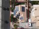 Aerial view of a house with solar panels, lush landscaping, and a two-car garage at 271 Francisco St, Henderson, NV 89014