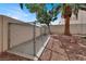 Enclosed chain-link dog run in the backyard with concrete base and desert landscaping at 271 Francisco St, Henderson, NV 89014