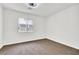 An empty bedroom with carpeted floors, a window with blinds, and white walls at 271 Francisco St, Henderson, NV 89014