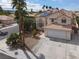 Inviting two-story home features a tile roof, two-car garage, and manicured landscaping at 271 Francisco St, Henderson, NV 89014