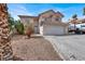 Charming two-story home featuring a terracotta roof, low maintenance landscaping, and a two-car garage at 271 Francisco St, Henderson, NV 89014