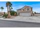 Inviting two-story home with a terracotta roof, palm trees, and a spacious driveway at 271 Francisco St, Henderson, NV 89014