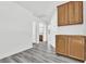 Hallway featuring wood look floors and plenty of cabinet space at 271 Francisco St, Henderson, NV 89014