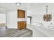 Bright hallway features wood-look flooring, storage cabinets and modern light fixtures at 271 Francisco St, Henderson, NV 89014