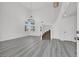 Bright living room with high ceilings, modern flooring, and staircase at 271 Francisco St, Henderson, NV 89014