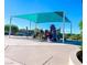 Community playground with a shade cover on a sunny day with playground equipment and seating area at 271 Francisco St, Henderson, NV 89014